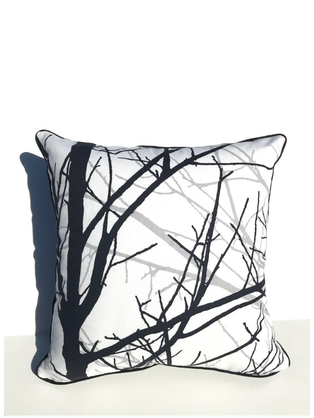 Throw pillow with piping. Zipper enclosure. Includes a down alternative insert.